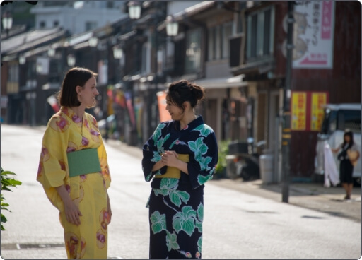 Two people dressing Kimono